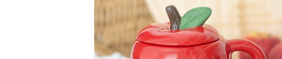 Apple-themed giftware and home decor range with rustic red apple designs, ideal for seasonal retail displays, teacher gifts or countryside-inspired interiors