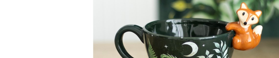 A charming woodland-inspired range featuring fawns, foxes and forest greenery in greens and soft, neutral tones, perfect for nature-themed retail displays.