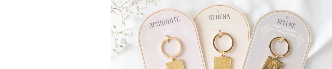 Goddess Energy wholesale gift collection inspired by the divine femininity of Selene, Aphrodite and Athena. Features affirmation cards, candles, talisman keyrings, jewellery, oil burners and crystal kits in soft pastel tones. Ideal for spiritual retailers, wellness boutiques and gift shops seeking empowering, goddess-themed stock focused on self-love and manifestation.