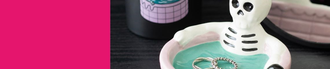 Dead Hot Days alternative summer gift range with sarcastic gothic designs including skeleton flamingos, skull sunflowers and poolside ghouls on keyrings, bags and home decor, ideal for goth gifts, alternative retailers and wholesale buyers worldwide.