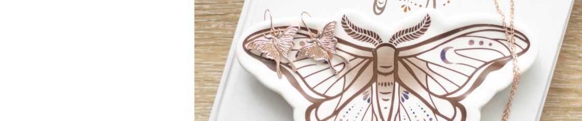 Light of the Luna Moth wholesale gift range featuring elegant, nature-inspired designs on incense, candles, mugs, journals, tote bags, jewellery and home decor. Showcasing the mystical luna moth in warm neutrals and metallics, this range is perfect for gift shops and lifestyle retailers looking for calming, contemporary products with a spiritual edge.