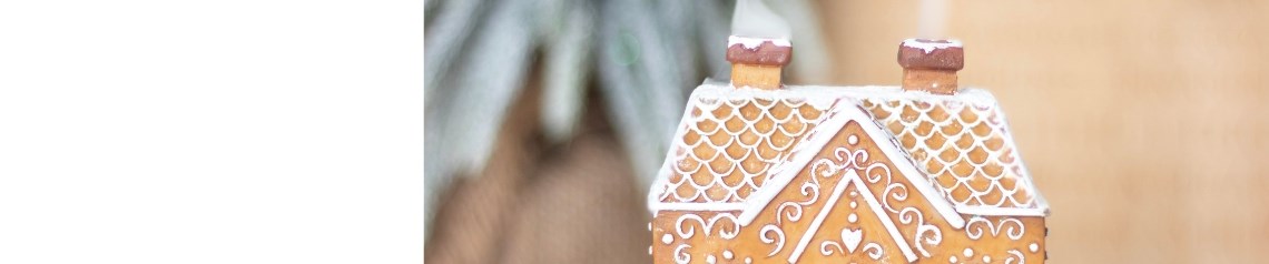 Christmas bakery-themed wholesale gifts including gingerbread candles and cookie cutter sets. Sweet seasonal homeware perfect for festive displays and family gifting.