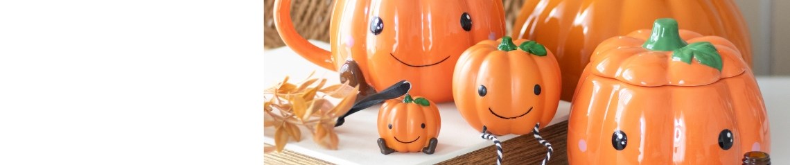 A playful collection of pumpkin-themed decorations with smiling faces, soft colours and friendly designs, ideal for family-friendly autumn displays.